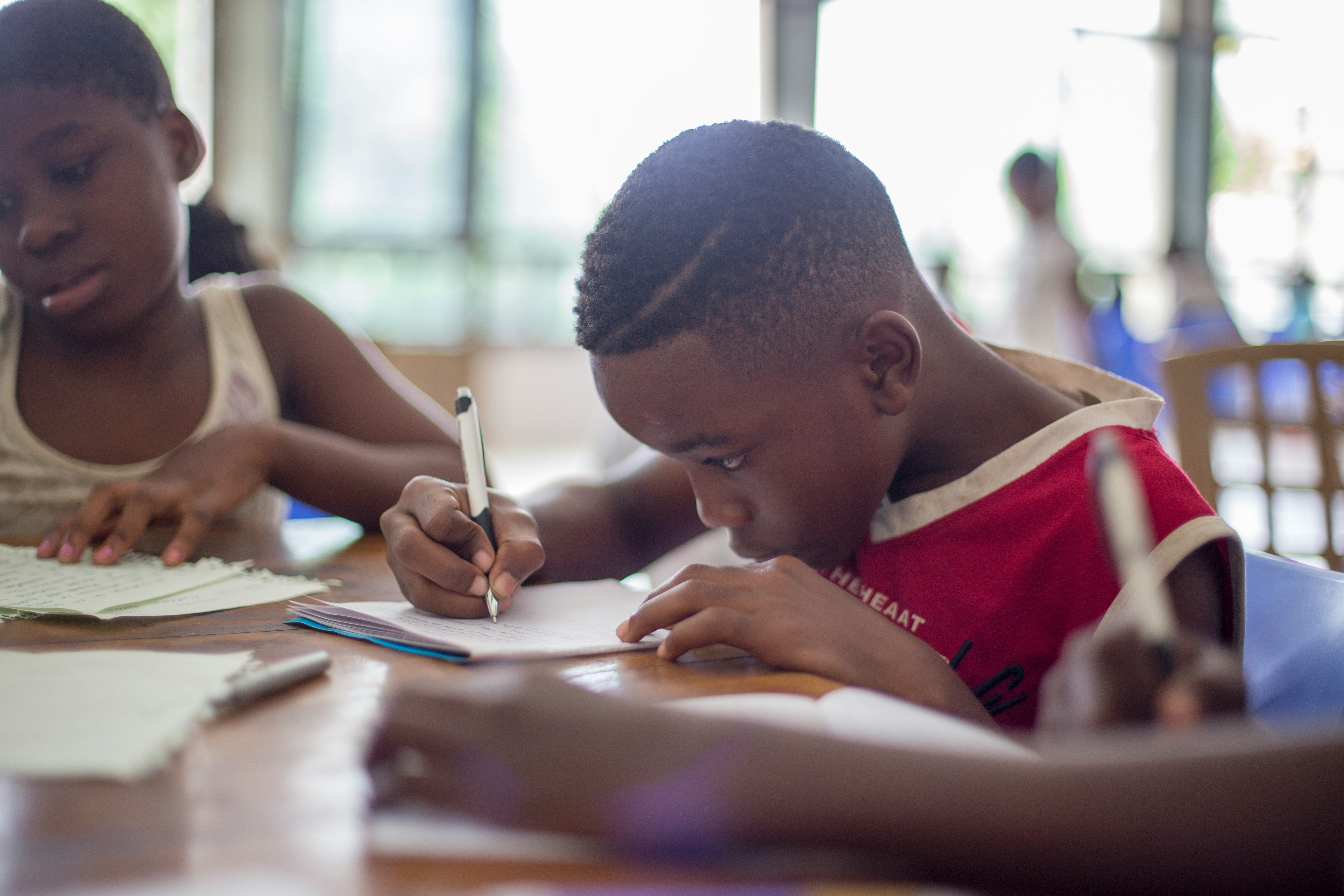 Black child focused on homework and studying